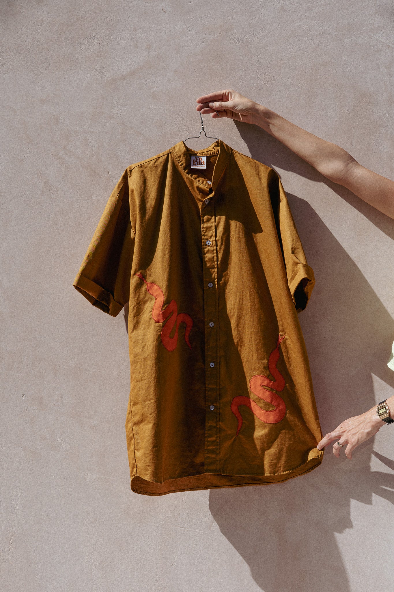 NYOKA shirt (olive green + orange snakes)