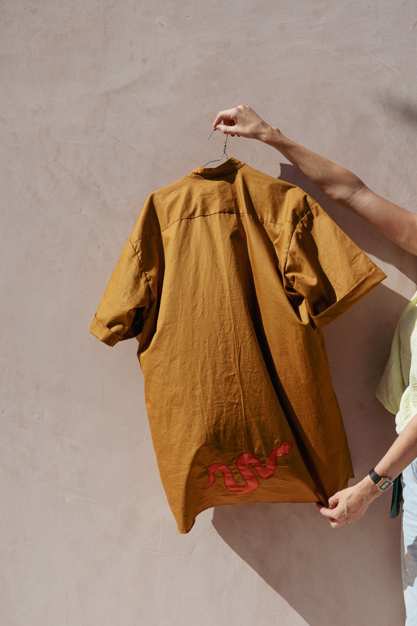 NYOKA shirt (olive green + orange snakes)